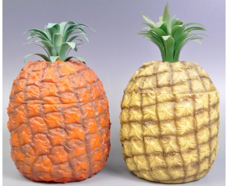 Two original retro vintage 20th Century cocktail bar novelty ice buckets in the form of pineapples comprising of a yellow exa