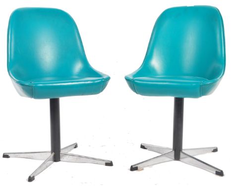 A matching pair of retro vintage 20th Century swivel tub / dining chairs upholstered in a turquoise vinyl with cushioned seat