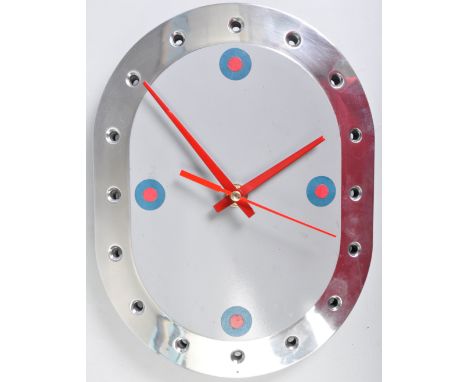 An industrial aviation bespoke clock made from the inspection panel from a Tornado Jet Fighter. The oval cartouche panel set 