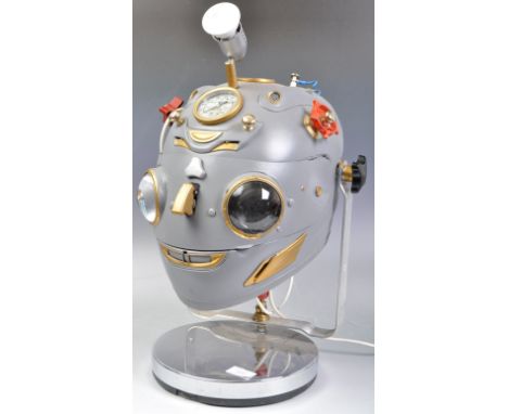 An impressive and unusual over-sized robot head steampunk disco light display. Plastic head, fitted with various lights, gaug