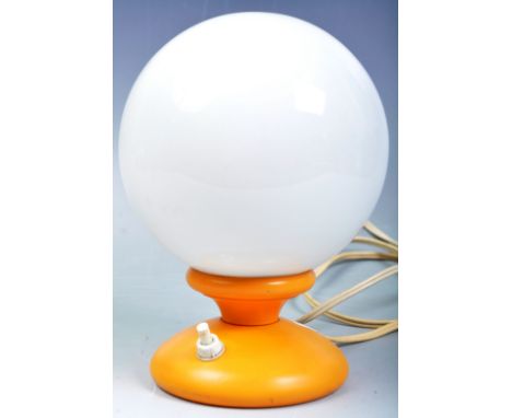 An original retro vintage 1960s Globe desk / table lamp. Globular milk glass shade, mounted on an orange plastic rounded step