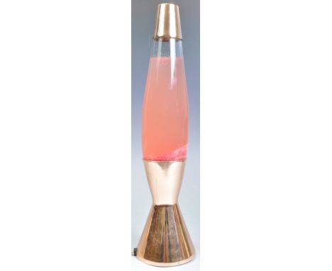 An original retro vintage 20th Century space age UFO rocket lava lamp having copper covered metal mount to top raised on a do