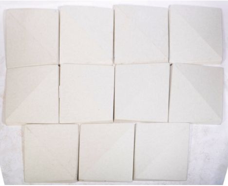 A set of contemporary 20th Century modular felt wall art system comprising of multiple grey felt oblong panels with velcro mo