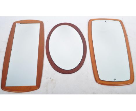 Three retro vintage 1960's teak wood framed wall mirrors. The hanging mirrors comprising of central rectangular mirror panels