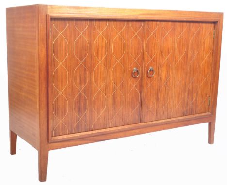 Gordon Russell - Helix Double - A fantastic retro 20th Century teak wood sideboard credenza having twin doors with carved pat