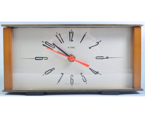 Metamec - Original retro mid 20th Century English teak and brass mantel clock of rectangular form having a silvered face with