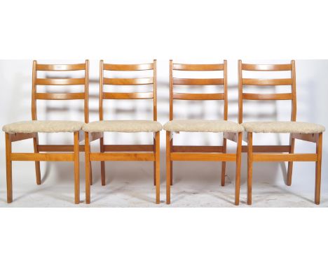 A set of four retro vintage 1960's beech and elm dining chairs / side chairs having ladder back rests with cushion seats rais