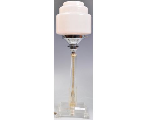 A retro vintage early 20th Century Art Deco table lamp having a pink opaline shade raised on lucite square column raised over