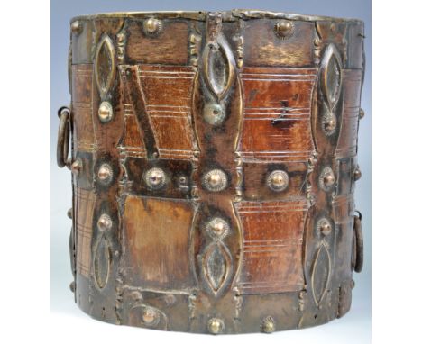 A decorative antique / medieval style water well bucket of wooden construction having large applied metal and studded bands w