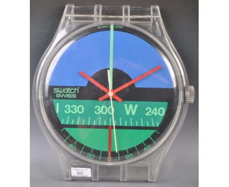 Nicolas Hayek - Swatch - Nautilus - An original retro vintage 1980's advertising point of sale shop display wall clock in the