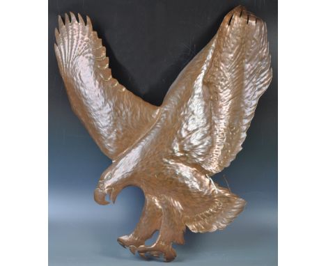 A fabulous 20th Century retro vintage hammered and moulded copper art wall hanging in the form of a praying eagle mid flight 