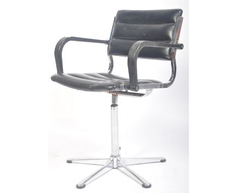 A retro vintage 1970's black vinyl / leather and chrome industrial office machinist swivel chair having a ribbed seat and bac