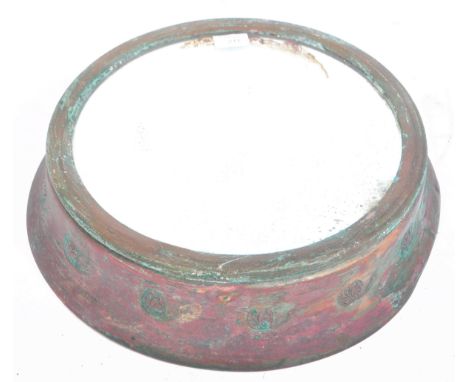 An early 20th Century copper porthole window style framed industrial mirror of circular form having a central mirror panel wi