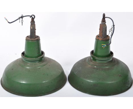 A matching pair of retro vintage 20th Century English industrial porcelain enamel pendant hanging lights having large UFO wid