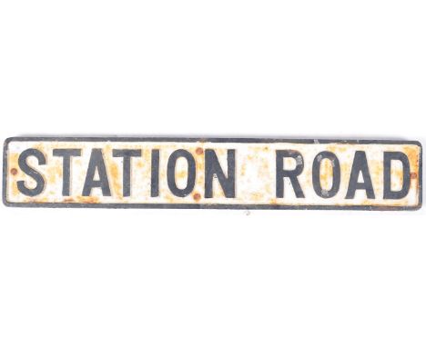 A good vintage 20th Century heavy cast iron road sign for Station Road. The sign of rounded rectangular form having a white g