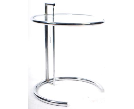 A modern design retro style occasional / side lamp table of chromed tubular construction having an adjustable rise and full c