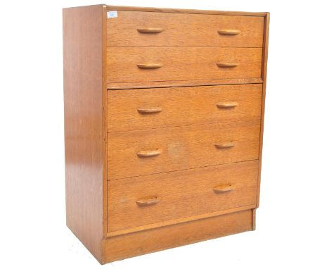 E. Gomme- G Plan- Brandon Range - A retro vintage mid Century golden oak chest of drawers having a two over three drawer conf