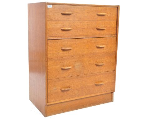 E. Gomme- G Plan- Brandon Range - A retro vintage mid Century golden oak chest of drawers having a two over three drawer conf