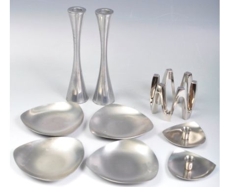 A collection of retro vintage 20th Century Danish and Danish influence stainless steel candlestick holders comprising of a pa