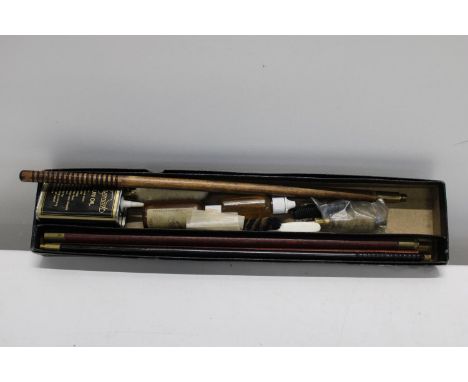 A vintage gun cleaning kit 