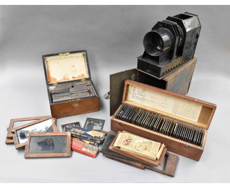 with unmarked brass lens together with assorted Magic Lantern slides: five with moving slides and numerous colour and black a