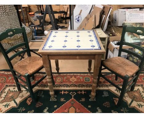 Small pine kitchen table with tile inlay and a pair of rush-seated chairs.  Table approx 68cm square