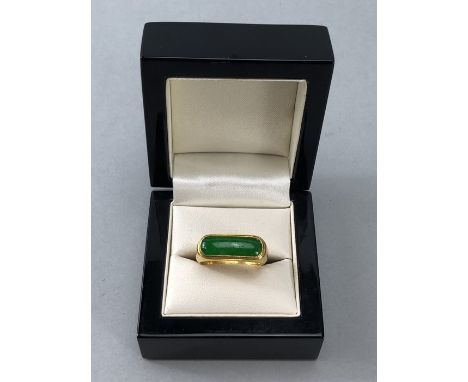 Gold ring marked 9999/6666 and 'SK' set with a large green stone possibly Jade (Chinese) size 'S'