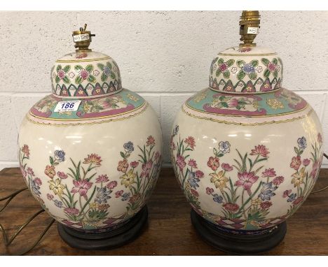 Pair of Chinese ceramic lamp bases with floral design, each approx 44cm in height