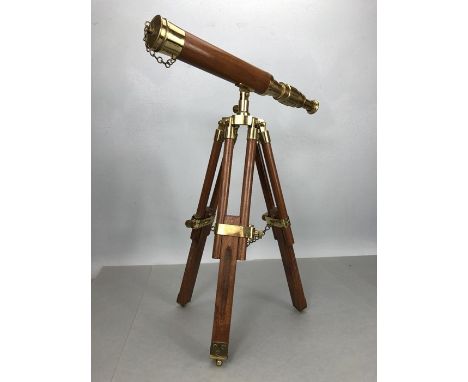 Small wooden telescope with brass fittings on tripod stand