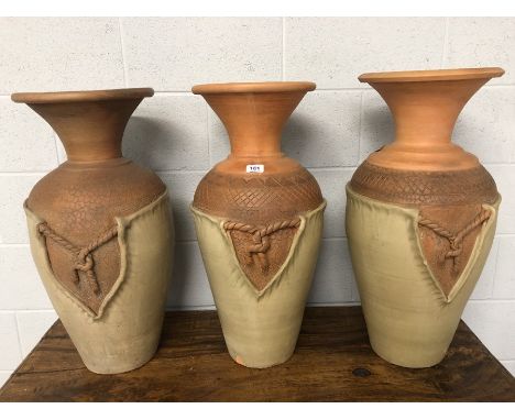 Three Ceramic Eastern urns, each approx 70cm in height