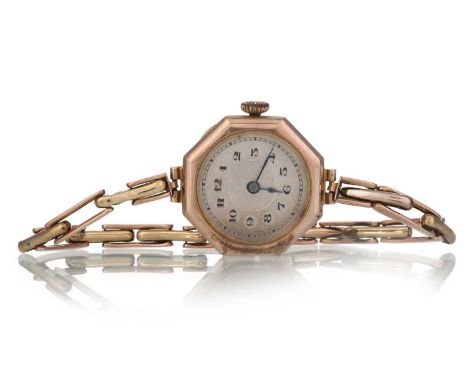 NINE CARAT GOLD CASED MANUAL WIND WRIST WATCH,  the round dial with Arabic hour markers, 25mm case, on an unmarked expanding 