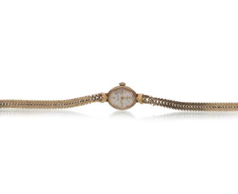ACCURST NINE CARAT GOLD MANUAL WIND WRIST WATCH,  the octagonal dial with baton hour markers, on a herringbone bracelet, in n
