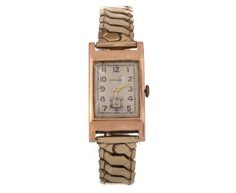NINE CARAT GOLD MANUAL WIND WRIST WATCH,  the rectangular dial with Arabic hour markers, 21mm case, on a gold plated expandin