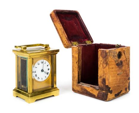 *Carriage clock. An Edwardian brass timepiece,  with circular white enamel dial, black roman numerals, blued steel hands, pla