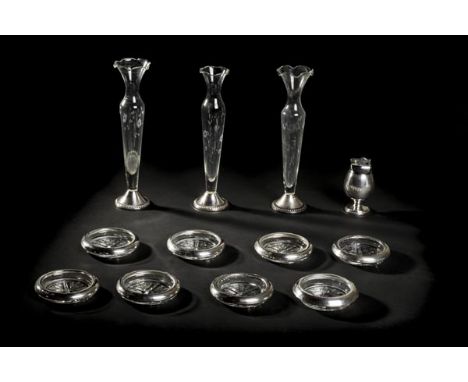 *Mixed silver. Three long glass vases,  each cut with floral decoration on sterling silver 'Duchin' bases, 25 cm high, togeth