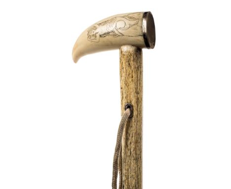 *Walking Cane. A 19th century walking stick,  with substantial spiral carved whalebone shaft with scrimshaw whales tooth hand