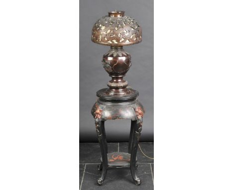 *Japanese Lamp. A Japanese bronze table lamp in the Meiji style,  cast with panels of exotic birds, peacocks and pine trees, 