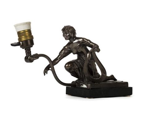 *Piano lamp. An Art Nouveau patinated spelter piano lamp,  modelled as female kneeling whilst leaning on a lyre, hinged lamp 