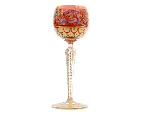 A late 19th Century Moser hock glass the ovoid bowl decorated with a band of floral scrolls in coloured enamelling above a re