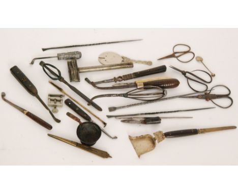 A collection of steel shafted opium pipe tools to include a Chinese silver handled example, steel cutting scissors and variou