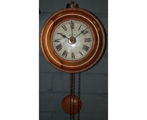 A late 19th Century and later converted postman's alarm clock, the dial named Lee's below a bell, width 24cm