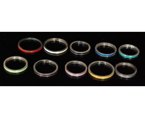 Ten assorted silver rings each with a different colour enamel decoration, various sizes, all Bernard Instone. (10). 