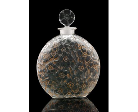 A Rene Lalique Le Lys glass scent bottle bottle, circa 1922, of compressed globe form with relief moulded lilies with cinnamo