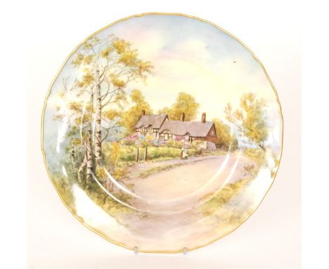 A Royal Worcester cabinet plate decorated with a scene of Anne Hathaway's Cottage, indistinctly signed, printed mark with dat