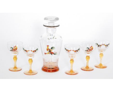 A 1930s Stuart & Sons cocktail decanter of shouldered form above an amber foot enamel decorated with a cockerel, height 23cm,