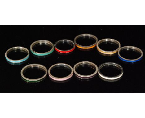 Ten assorted silver rings each with a different colour enamel decoration, various sizes, all Bernard Instone. (10). 