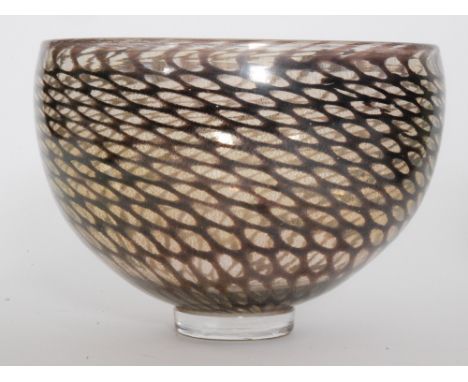 A large Blowzone studio glass bowl of footed ovoid form decorated with an amethyst scale netting amongst gold aventurine, eng