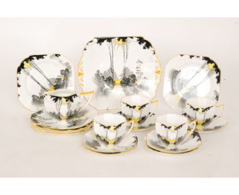 A collection of assorted 1930s Shelley Sunrise and Tall Trees pattern teawares comprising four Queen Anne cups, a milk jug, s