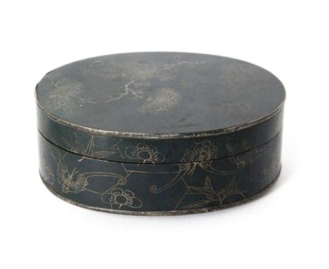 A Chinese engraved oval copper opium box, the cover decorated with a flowering bough and the sides with fauna and character s