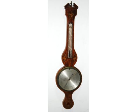 A George III inlaid mahogany wheel barometer inlaid with shell paterae and incorporating a thermometer, the silvered dial ins
